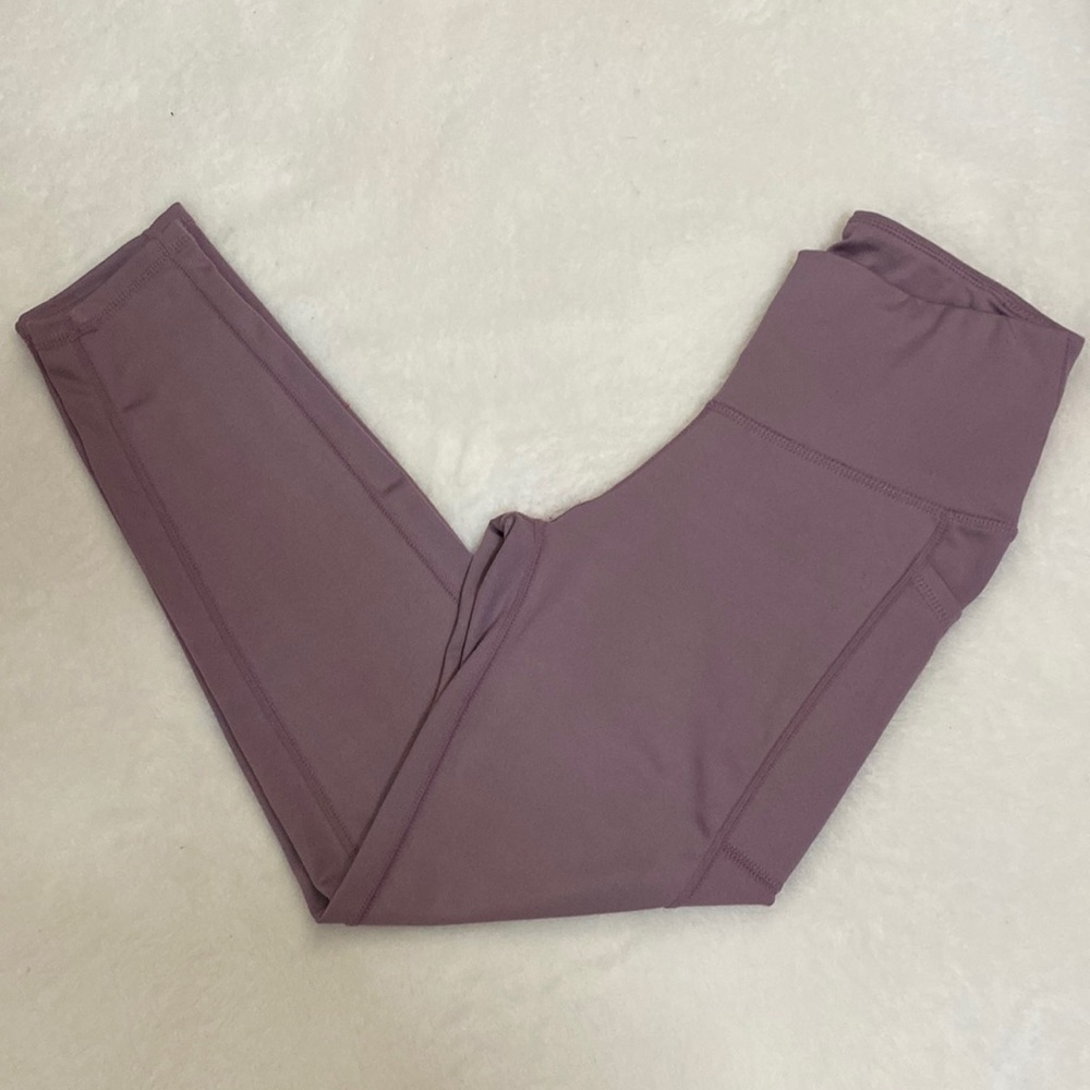 Size Small Buttery soft purple leggings. Full length. Pockets on both sides.